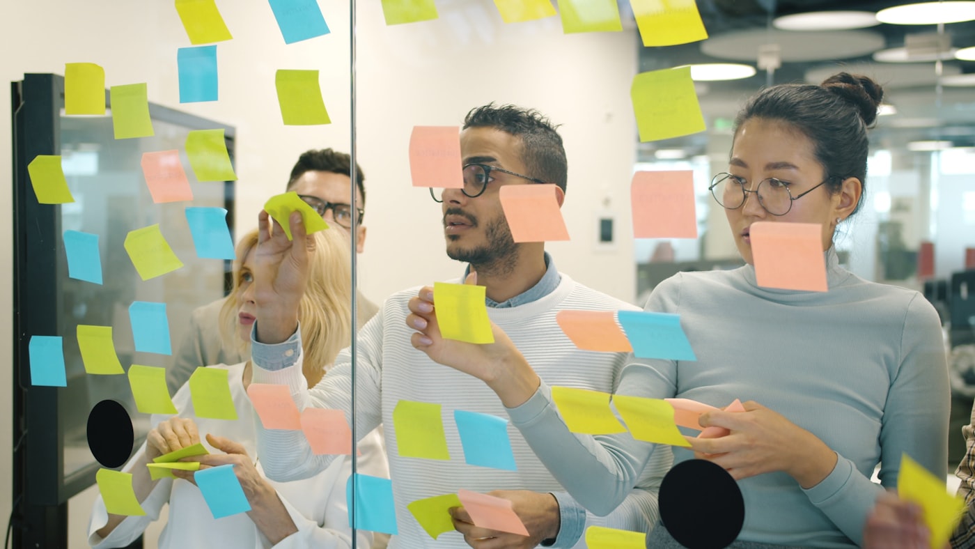 Creative team reviewing AI-generated ad variants in a collaborative session