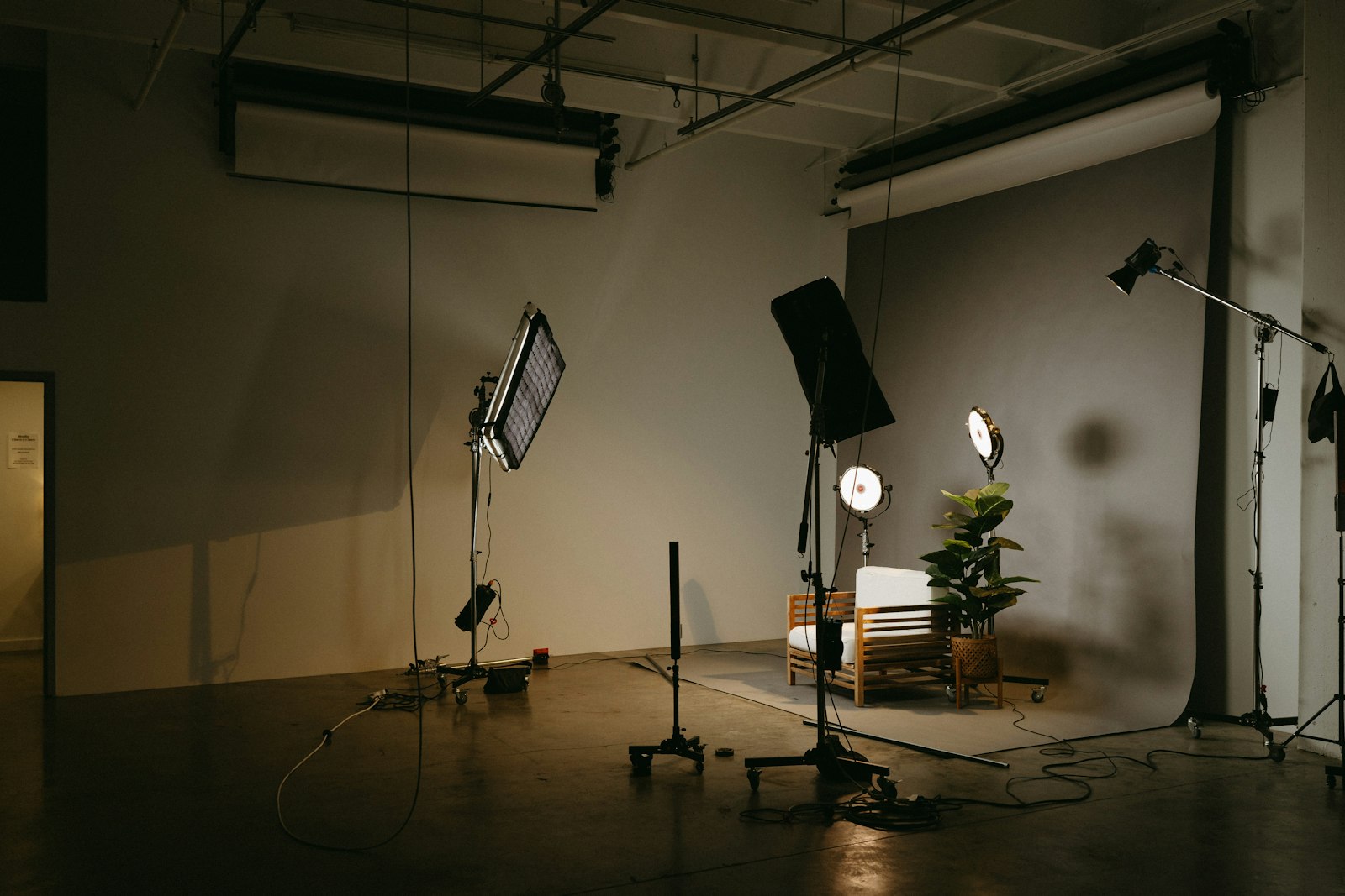 A video editing and campaign workspace with multiple screens, representing coordinating several YouTube campaigns under one reach and frequency goal